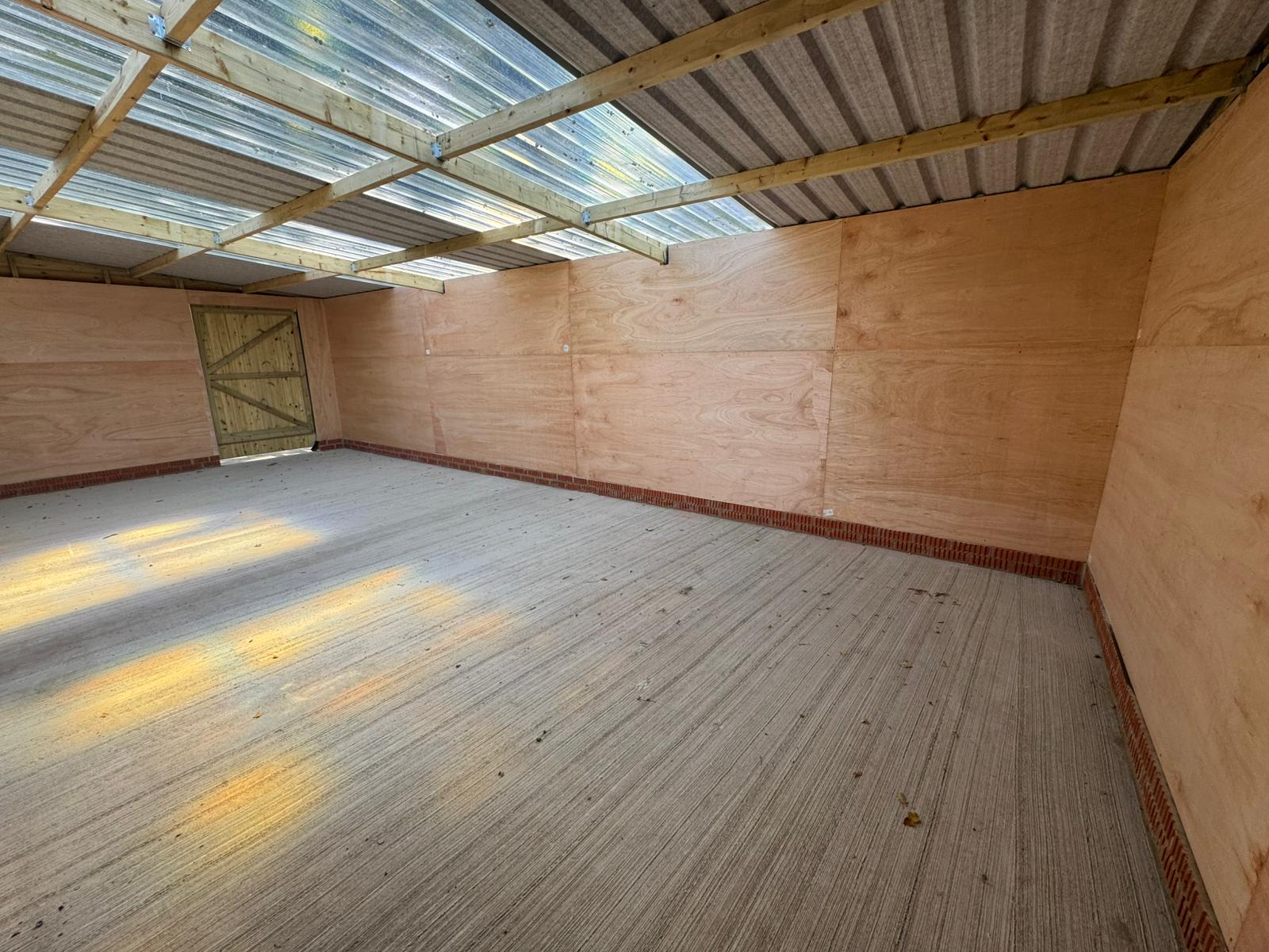 Interior of 12x36 timber workshop showing open workspace