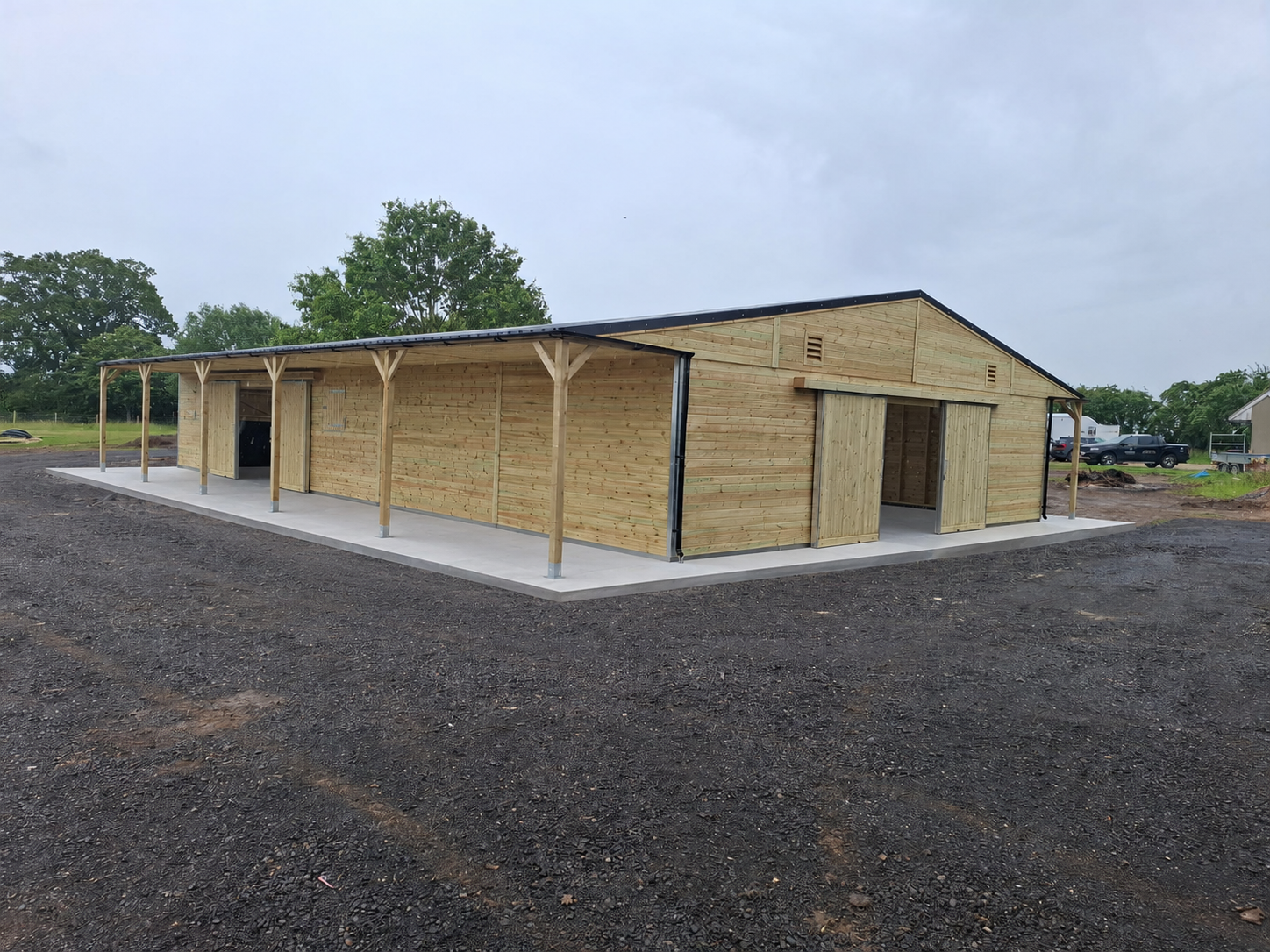 Hunter Stables timber American barn with spacious open bays and extended roof coverage