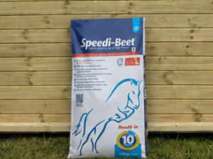 Speedi-Beet bag leaning against a timber stable building