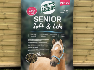Bailey no.26 Senior Soft and Lite 20kg bag leaning against a timber stable building