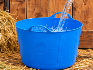Red Gorilla Extra Large Gorilla Tub 75L in Blue with water being poured in