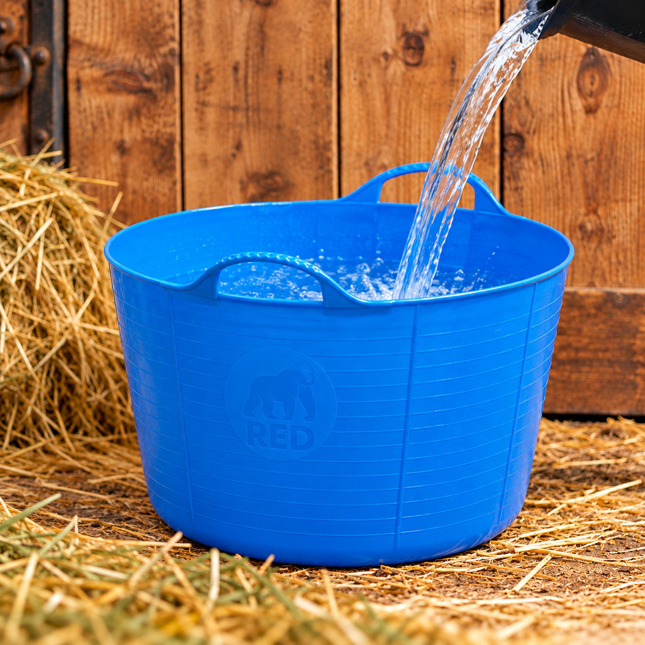 Red Gorilla Extra Large Gorilla Tub 75L in Blue with water being poured in