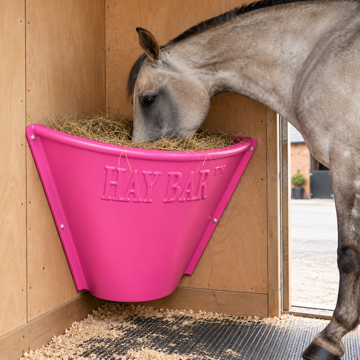 HayBar Classic Horse Pink hay feeder in wooden stable